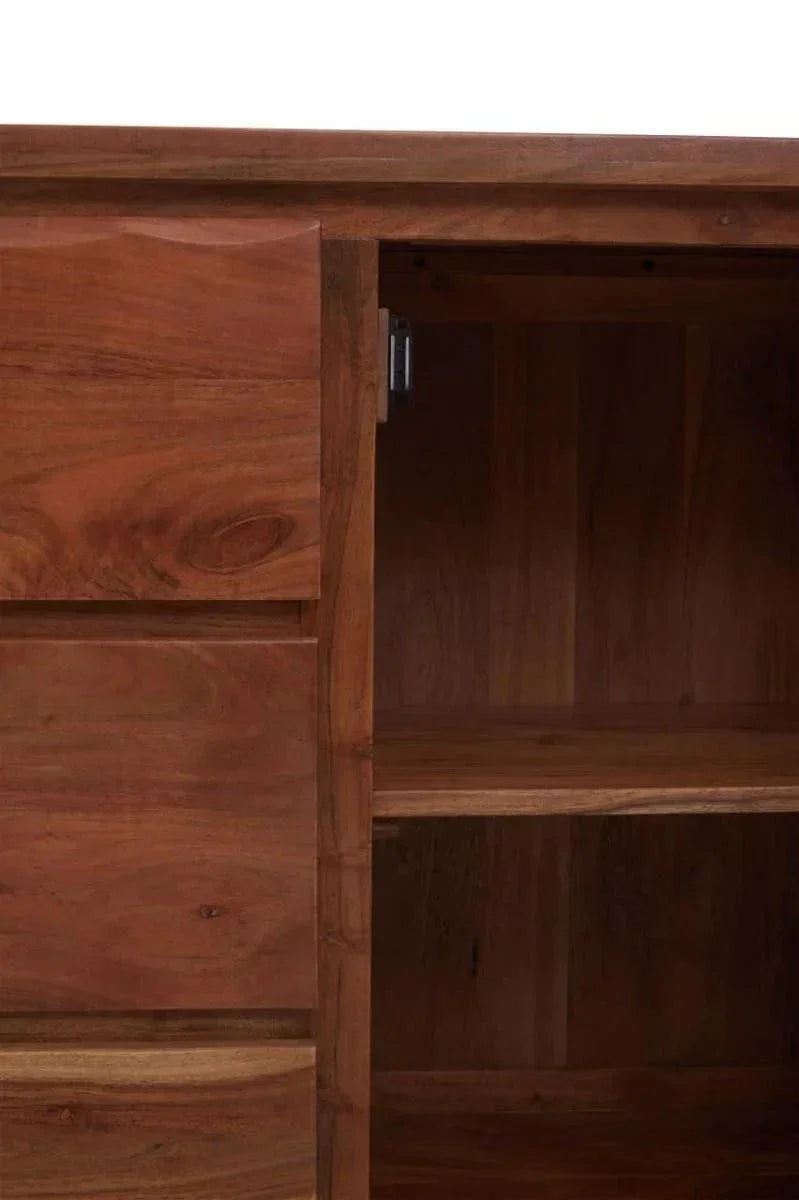Close-up of wooden cabinet with open door showing shelf and drawer detail