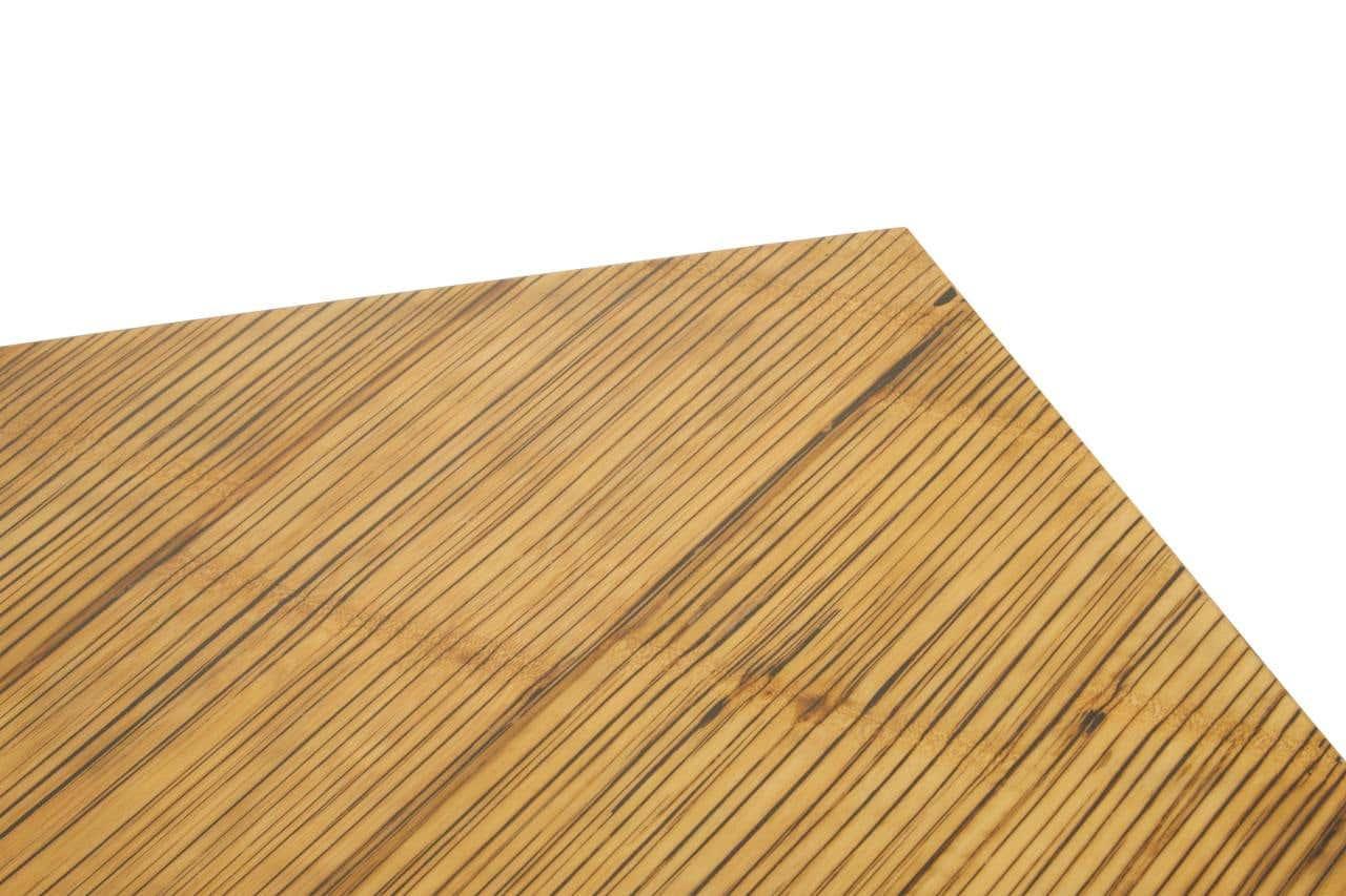 Closeup of rectangular wood dining table top with striped grain pattern