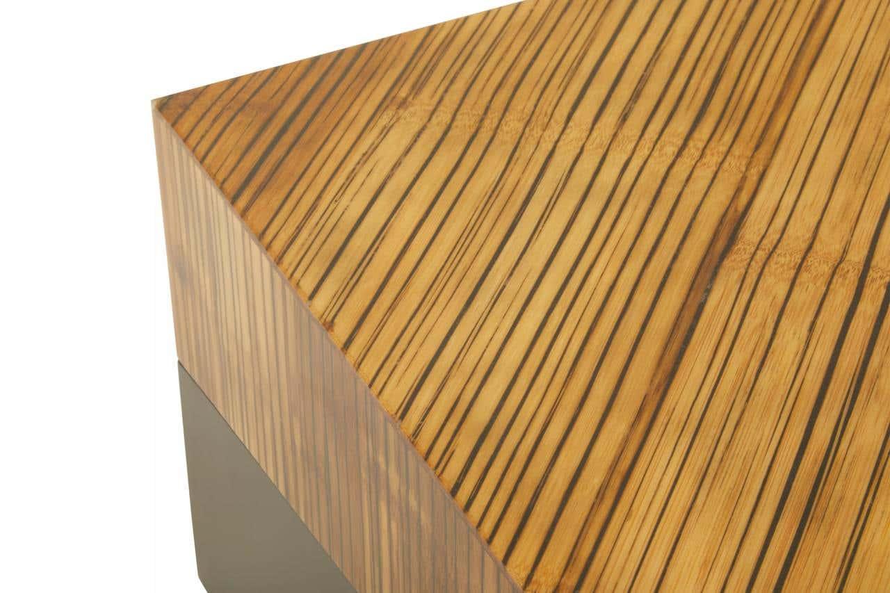 Closeup of wood grain coffee table corner with striped finish