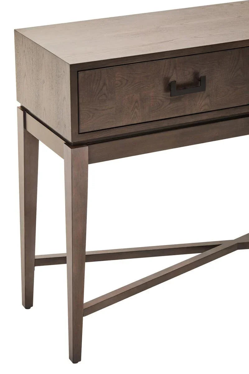 Dark wood console table with single drawer and black handle, angled legs and crossbar base