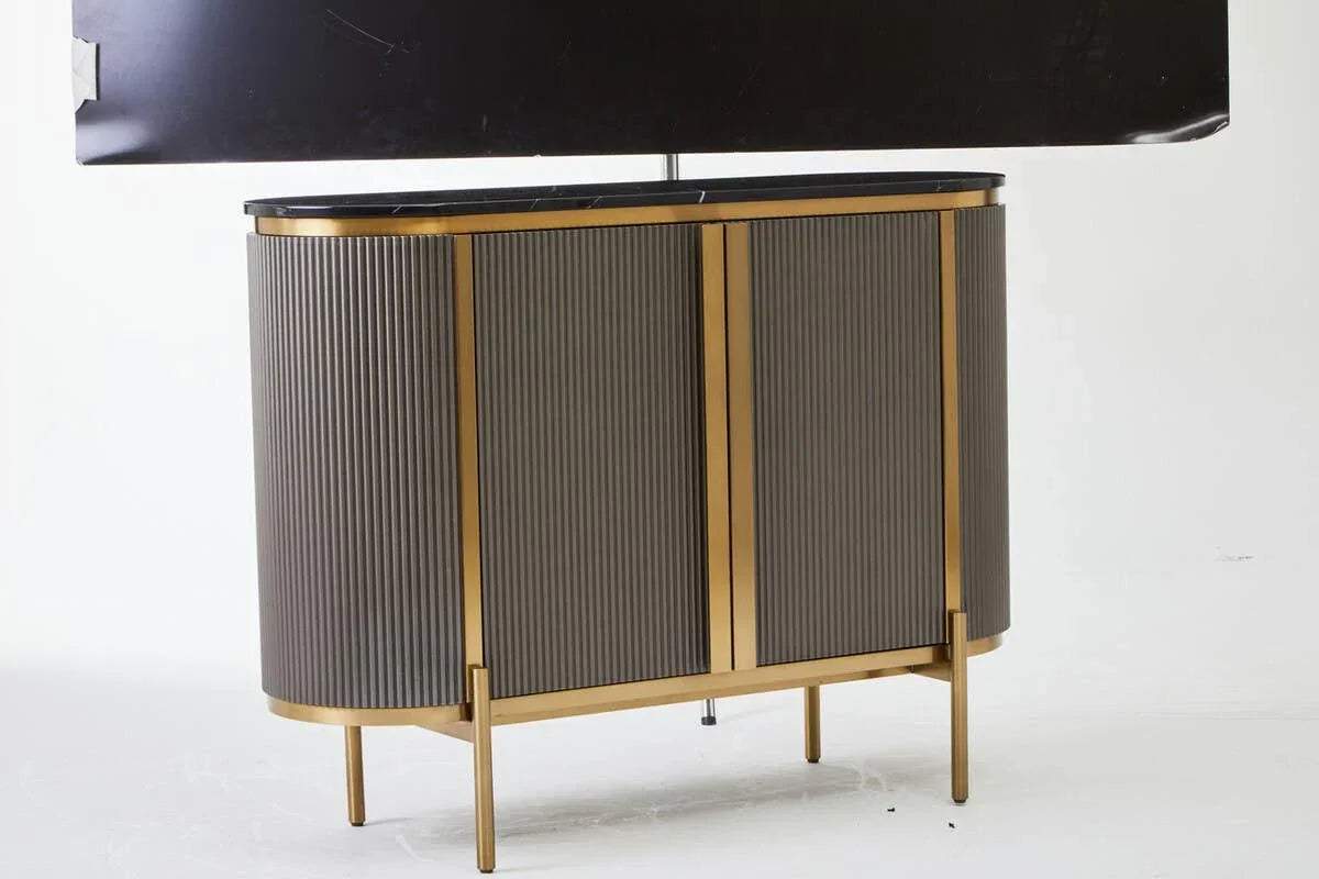 Contemporary sideboard with ribbed grey doors, gold trim and slim gold legs, front view