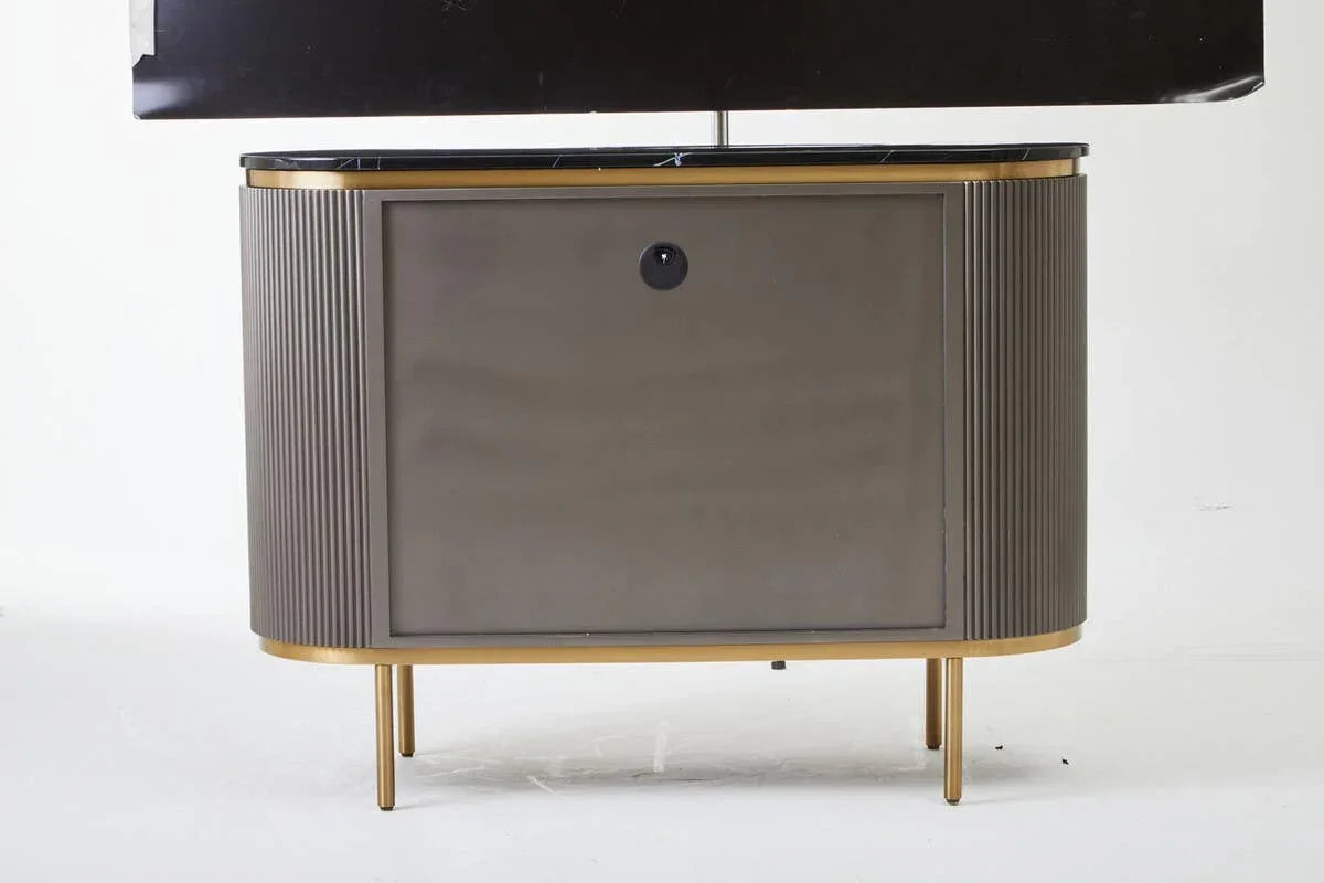 Modern TV unit with ribbed side panels, gold legs, and black marble top