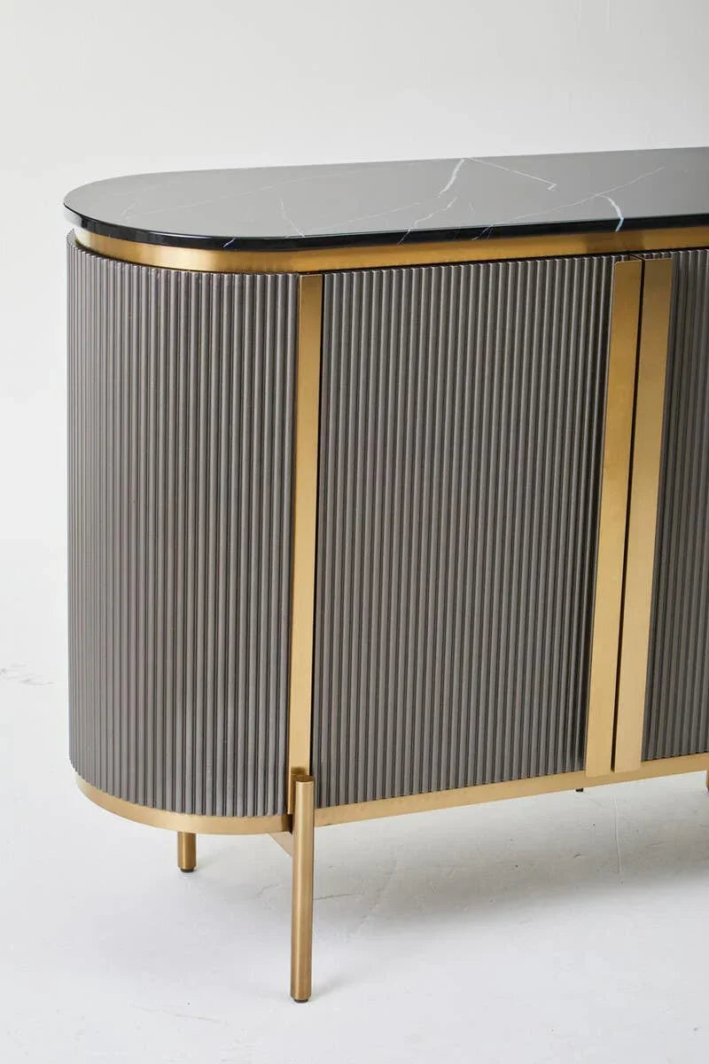 Grey sideboard with gold trim and black marble top, rounded edges, and ribbed doors