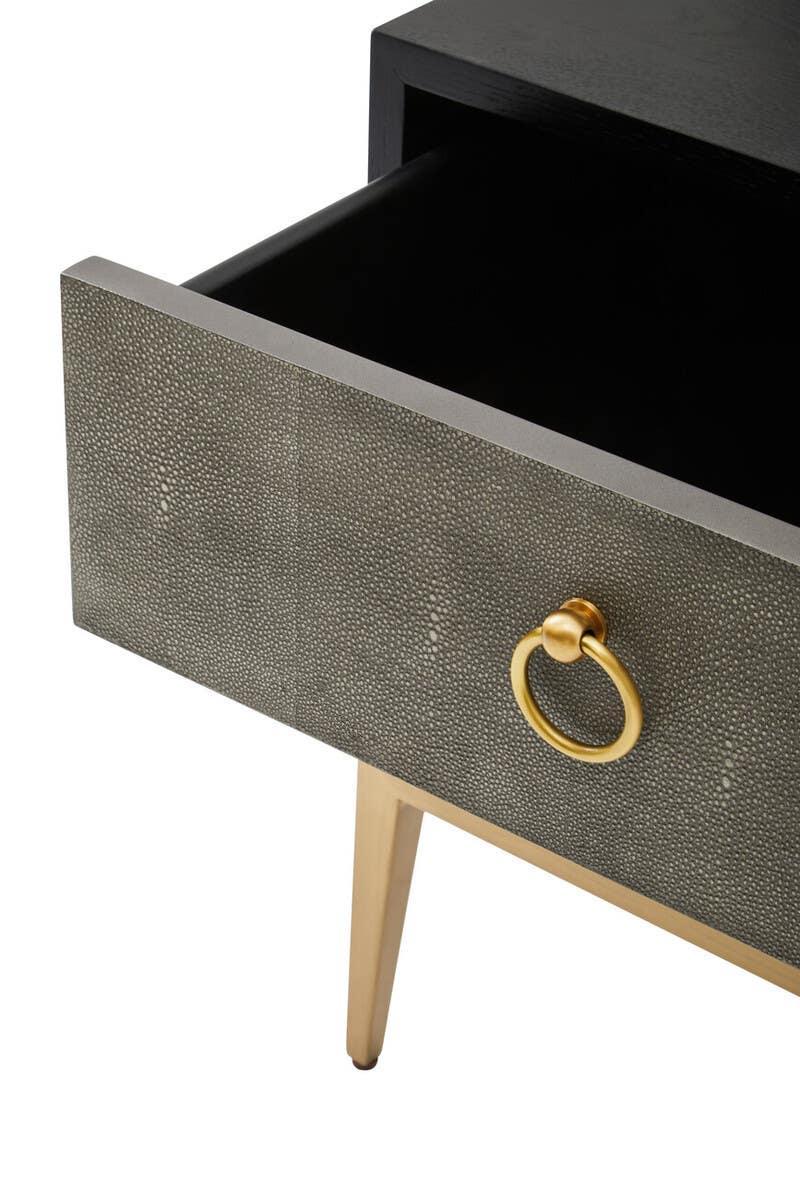 Modern bedside table with textured drawer front, gold ring handle and tapered legs