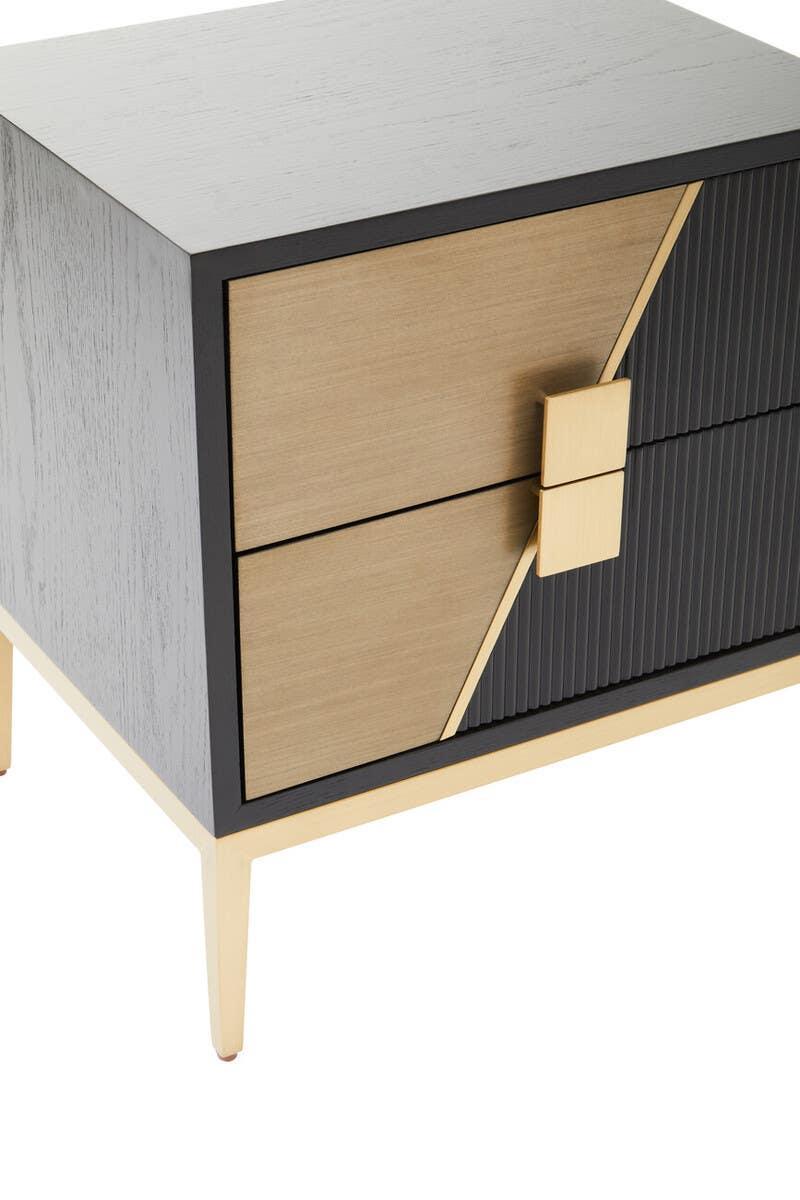 Modern bedside table with two-tone wood finish and gold accents on angled legs