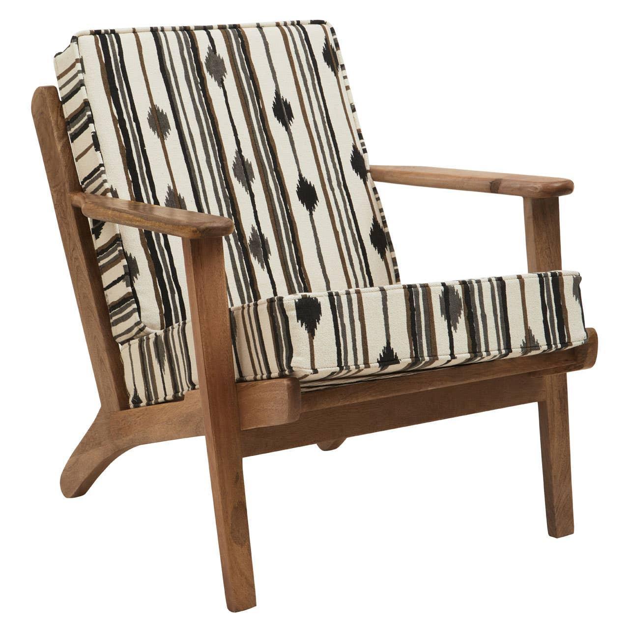 Wooden armchair with cream and black patterned cushions, angled front view
