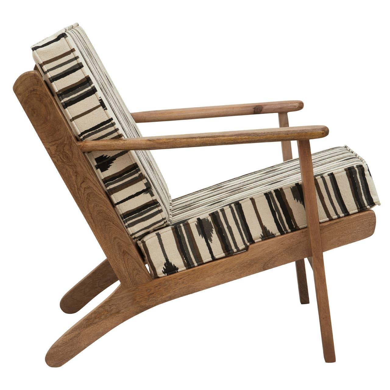 Modern accent chair with wooden frame and geometric black and cream cushions side view