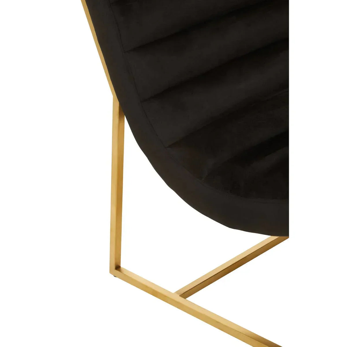 Close up of black velvet chair seat with gold metal frame