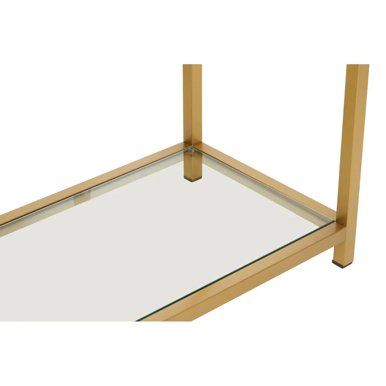 Gold metal frame coffee table with clear glass shelf, close-up of corner detail