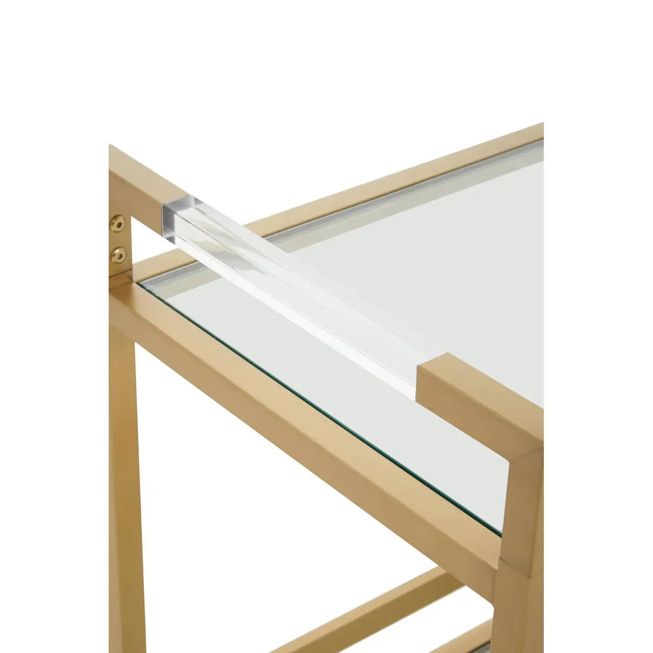 Gold metal side table with glass top and clear acrylic handle closeup