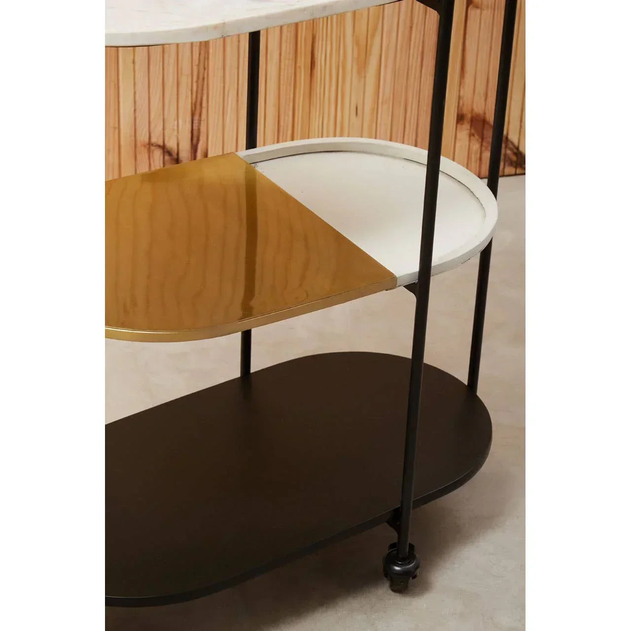 Three tier metal and marble shelving unit with gold, white and black shelf surfaces