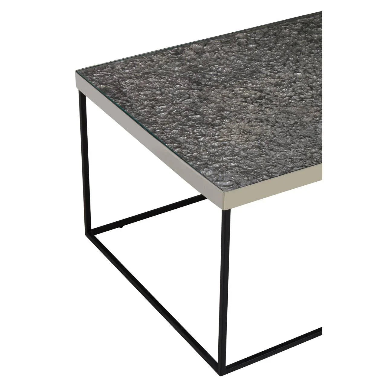 Modern coffee table with textured grey glass top and black metal frame, corner view