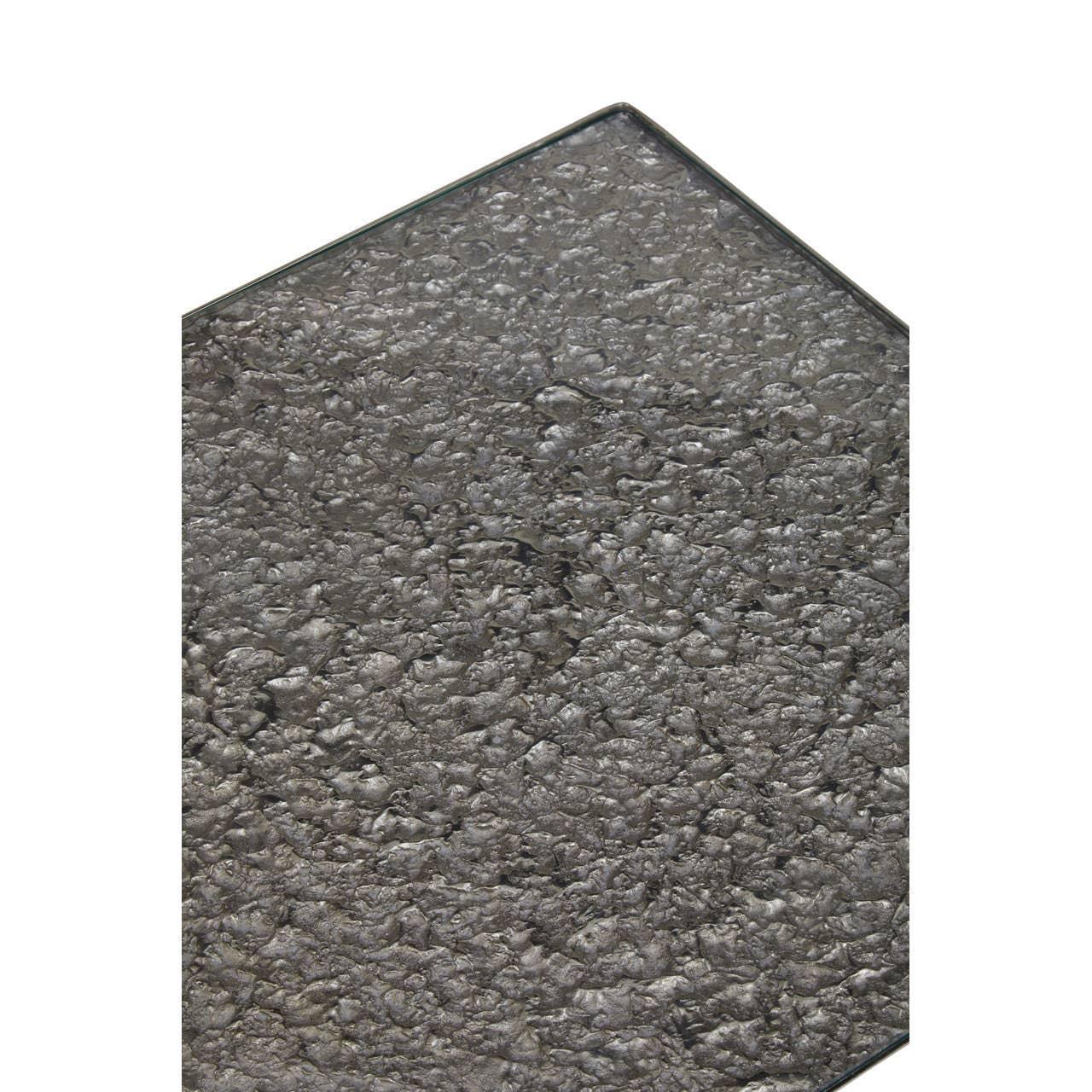 Textured dark stone tabletop with beveled edge, close-up of dining table surface