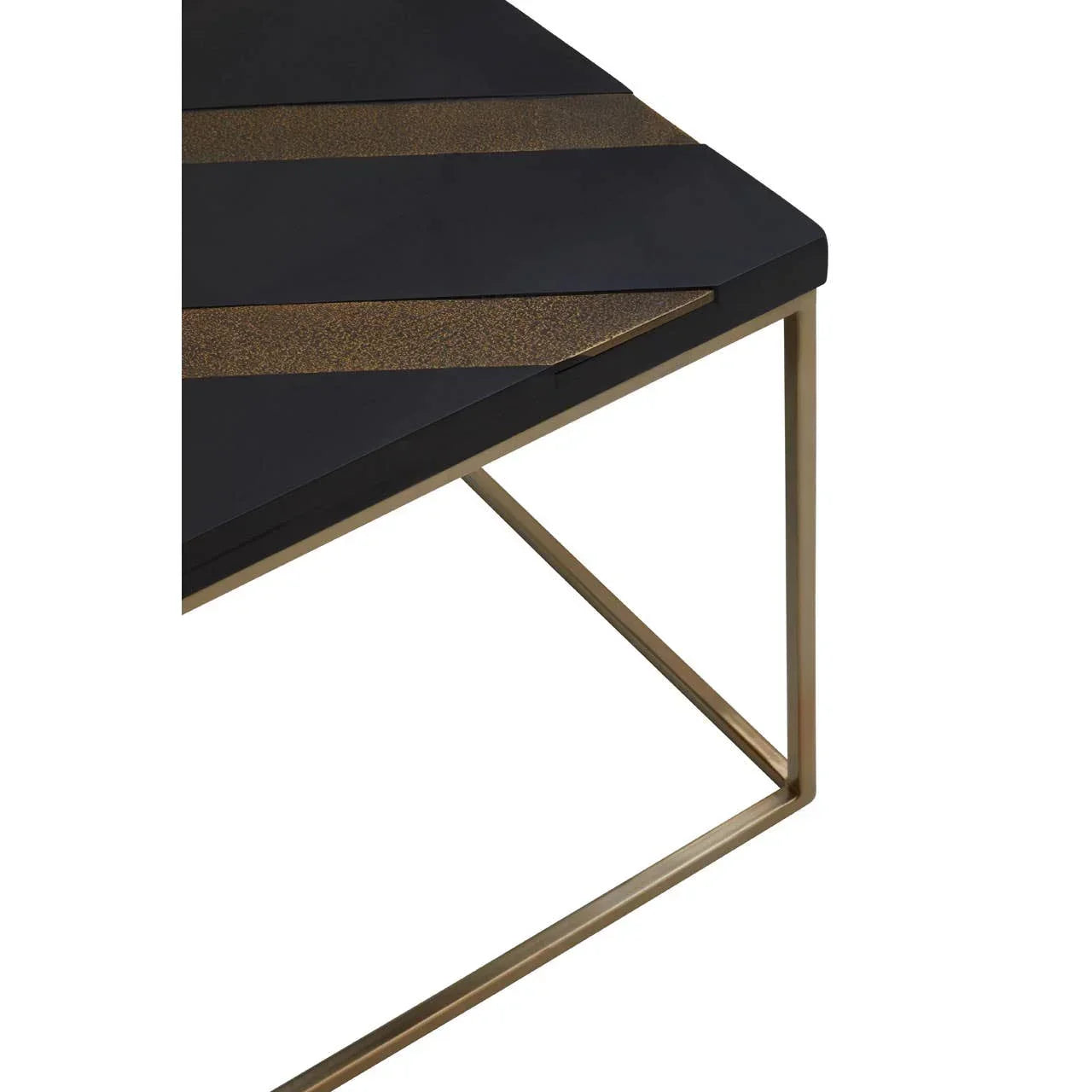 Modern coffee table with black and gold geometric top and gold metal legs, corner view