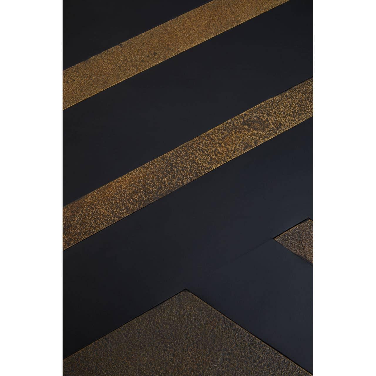 Close-up of black and gold dining table top with textured metallic finish and geometric lines