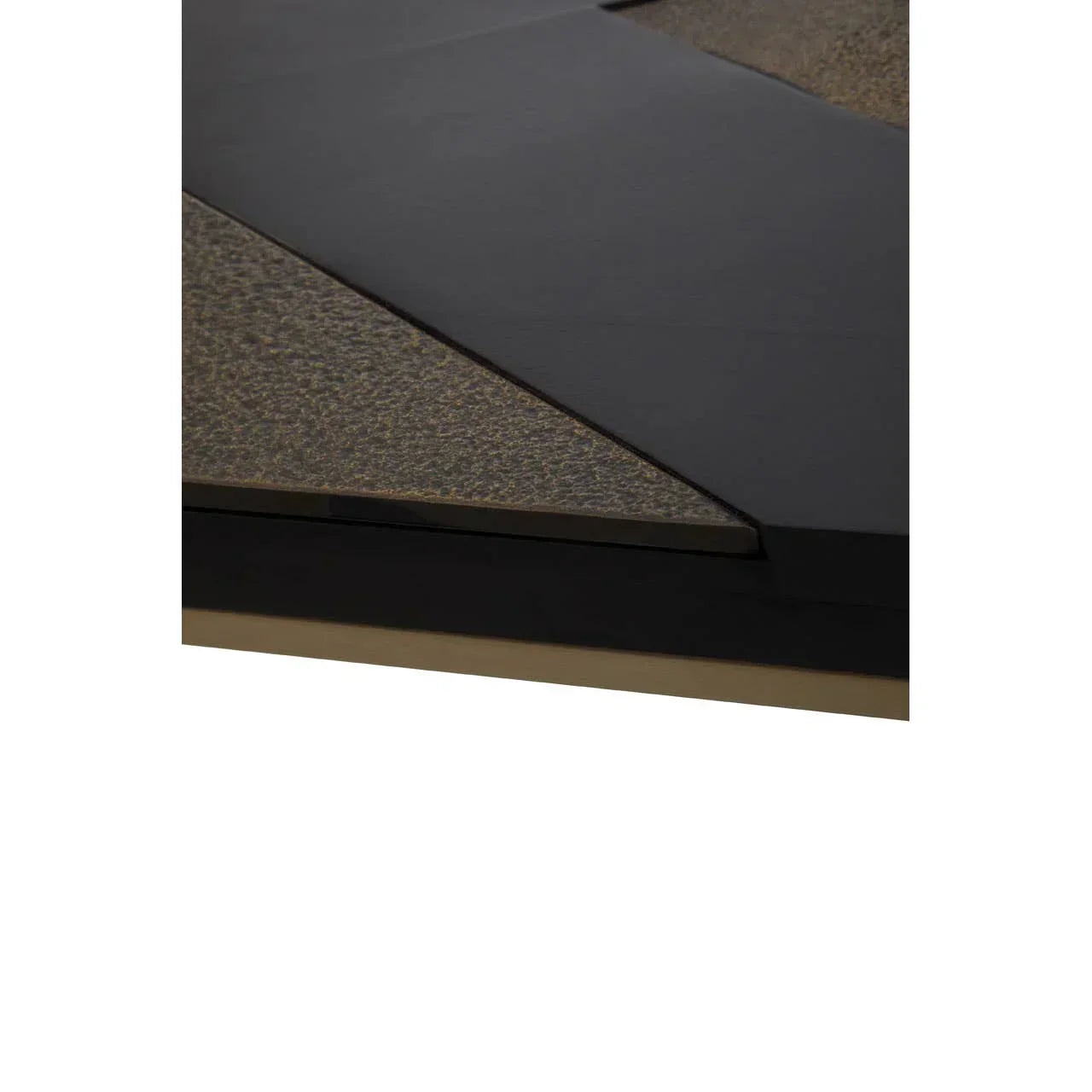 Closeup of black and textured stone coffee table top with geometric design detail