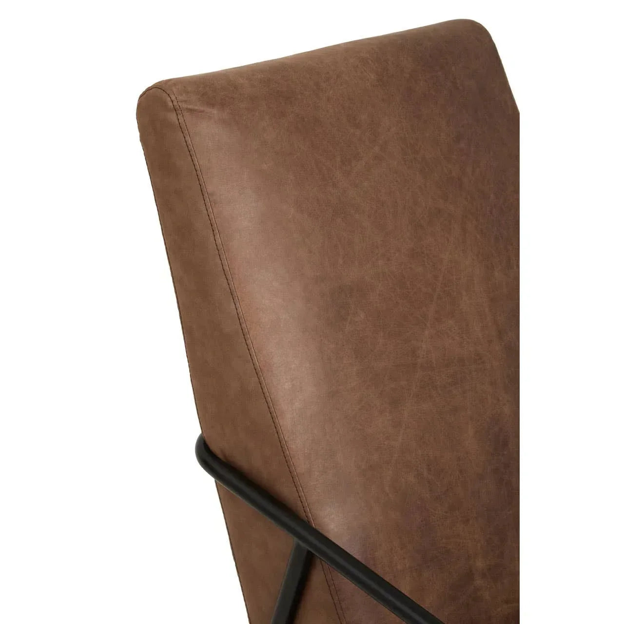 Closeup of brown faux leather chair backrest with black metal frame detail