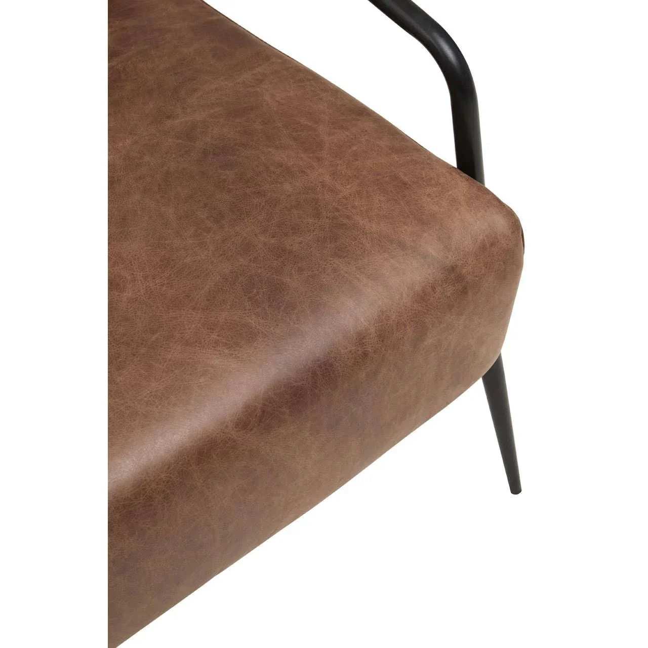 Brown faux leather chair seat with black metal armrest and leg, close-up view