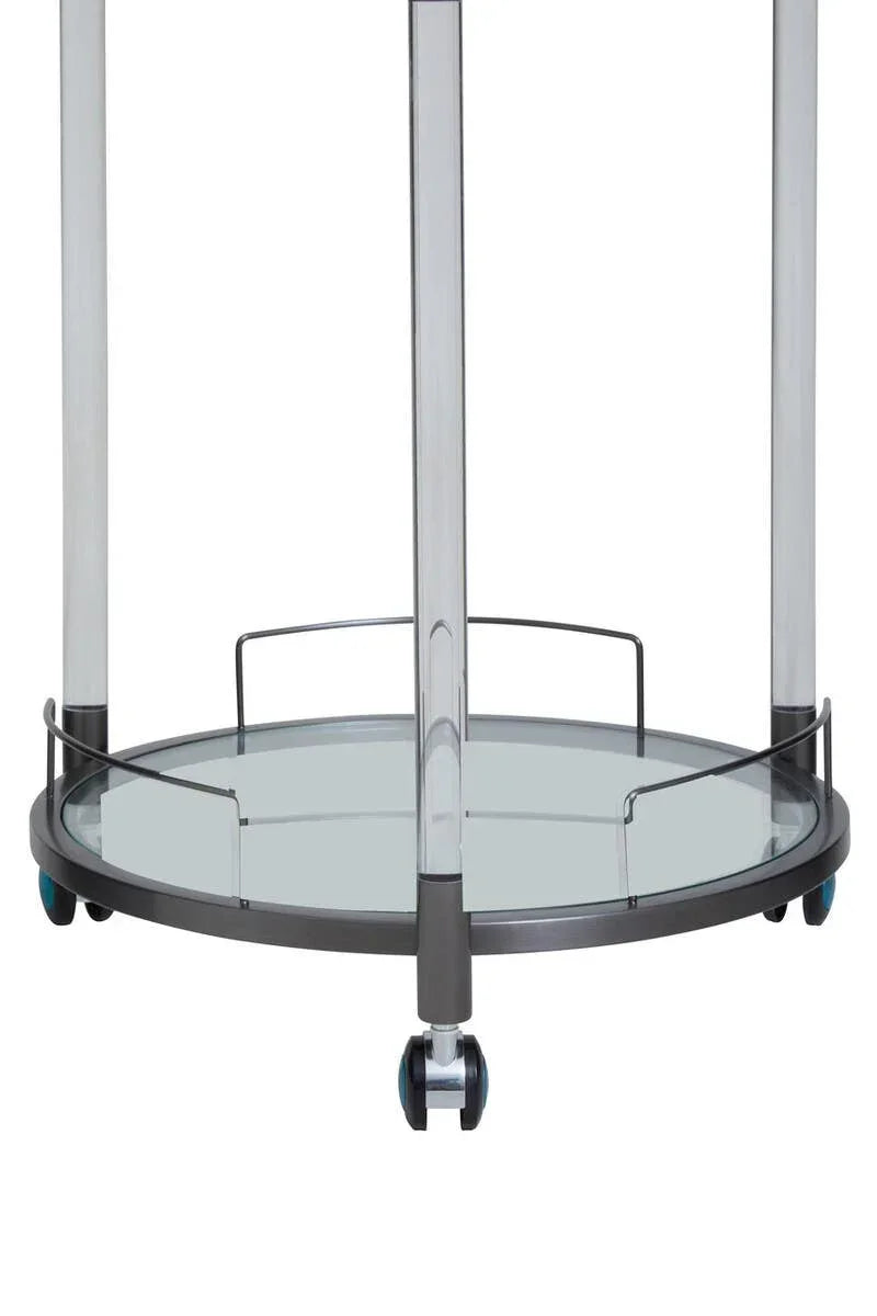 Glass serving trolley with round metal frame and caster wheels, close-up of lower shelf