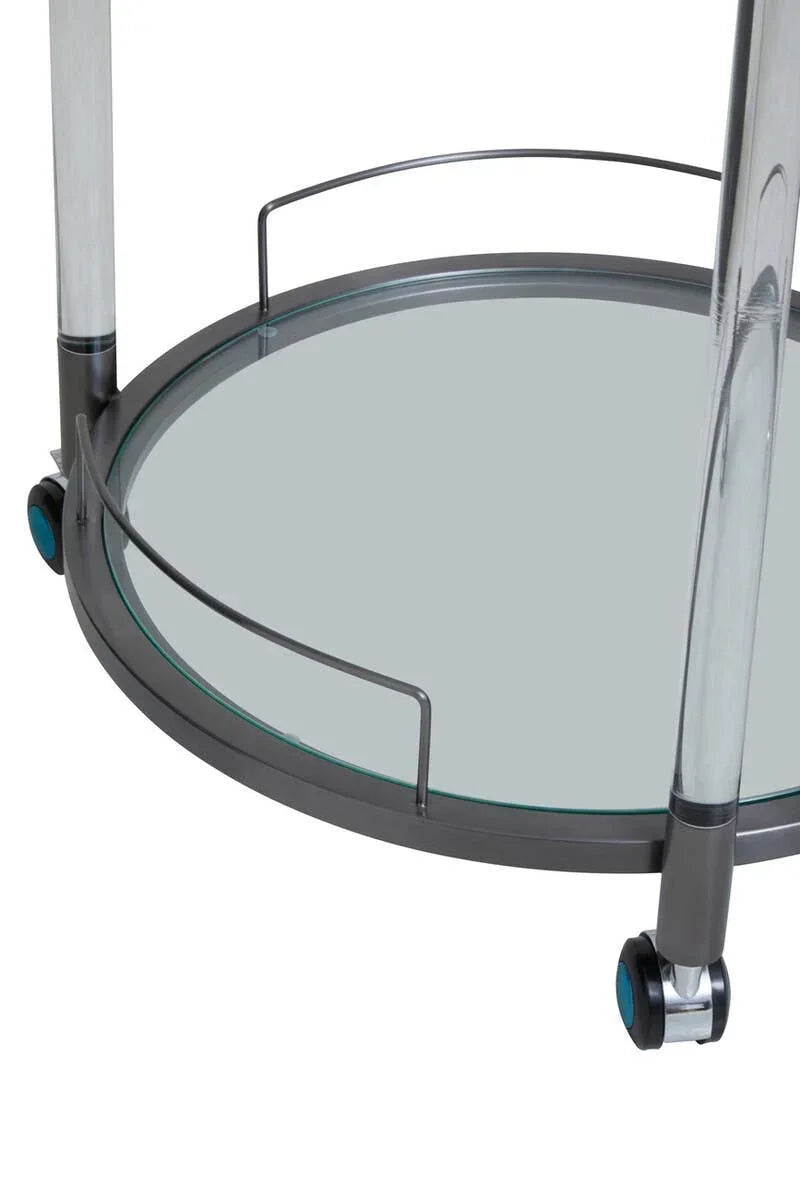 Close view of glass and metal serving trolley bottom shelf with wheels