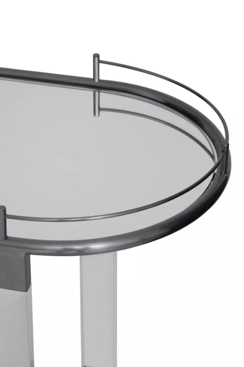 Glass top side table with silver metal frame and curved rail detail