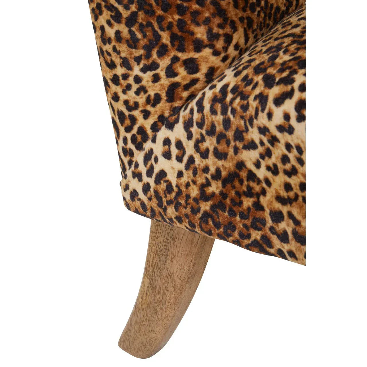 Close detail of leopard print armchair fabric and wooden leg