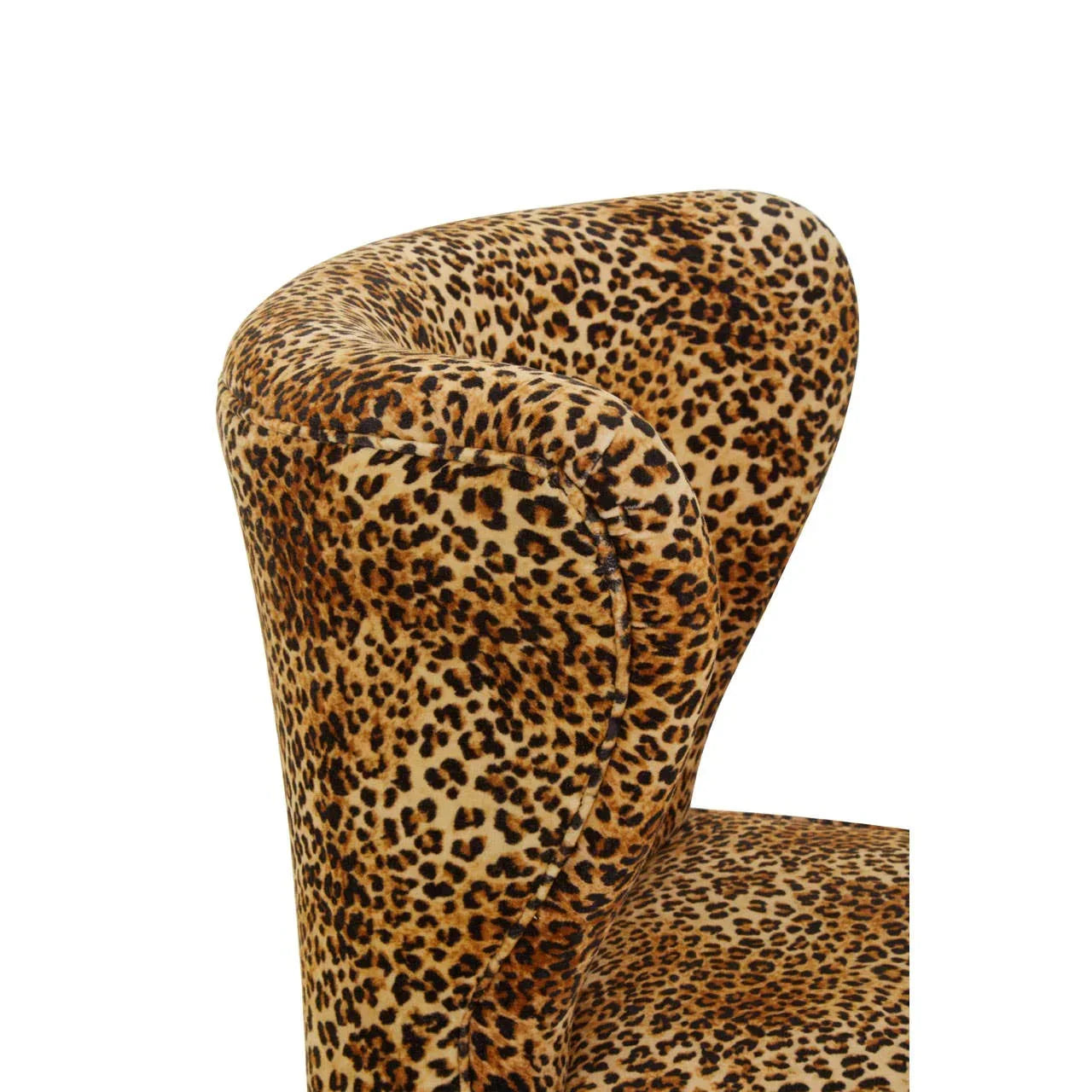 Closeup of leopard print accent chair upholstery with curved armrest and backrest