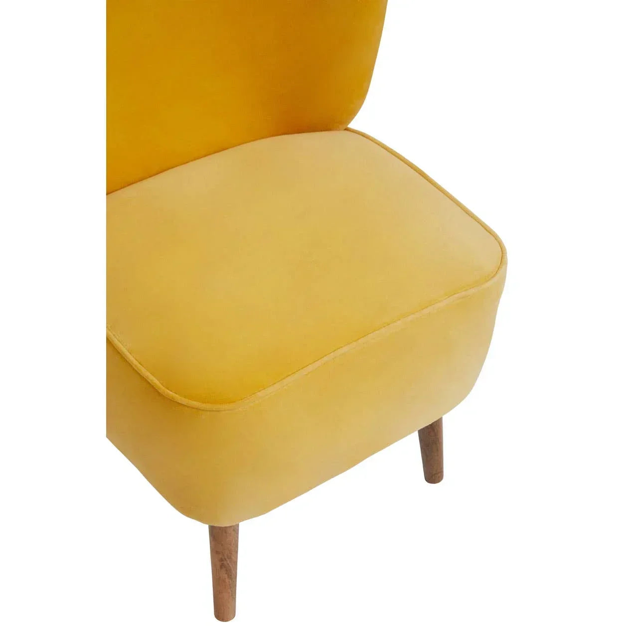 Yellow velvet accent chair with wooden legs, close-up of seat and fabric