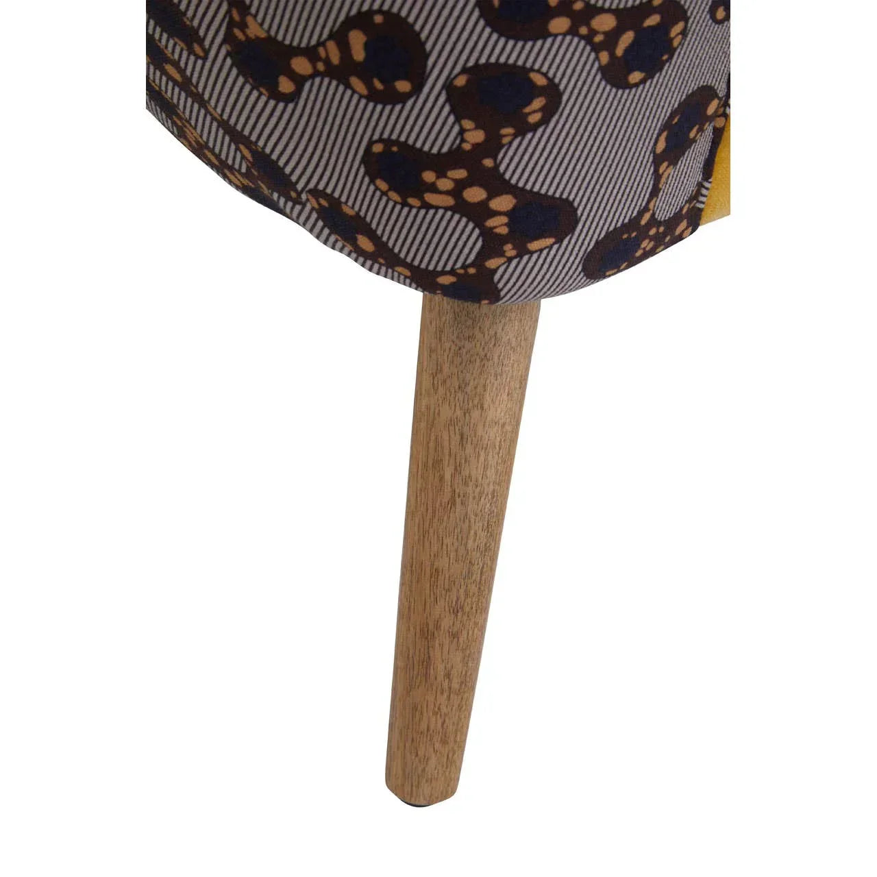 Upholstered furniture with patterned fabric and wooden tapered leg close-up