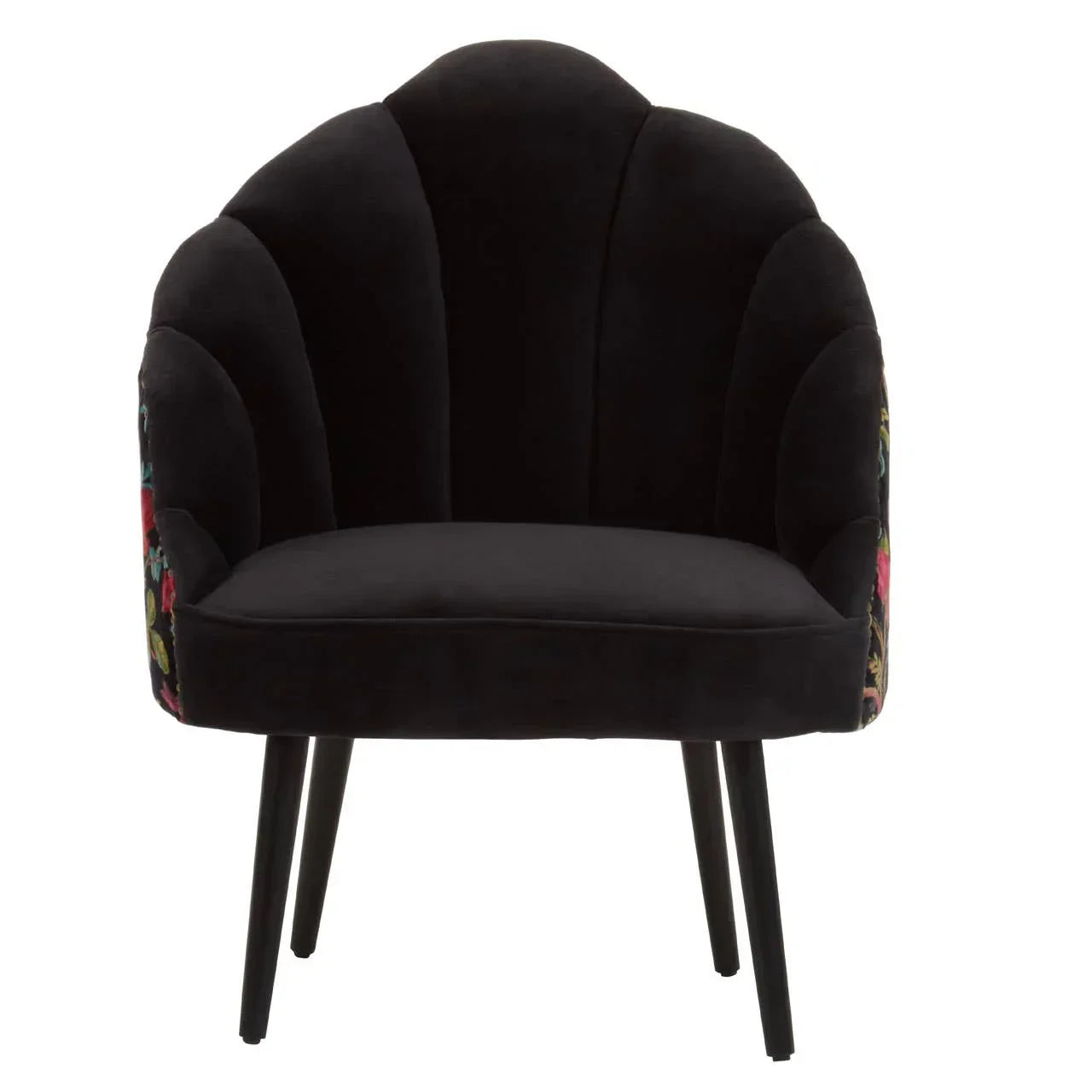 Black velvet accent chair with floral pattern on sides and scalloped backrest