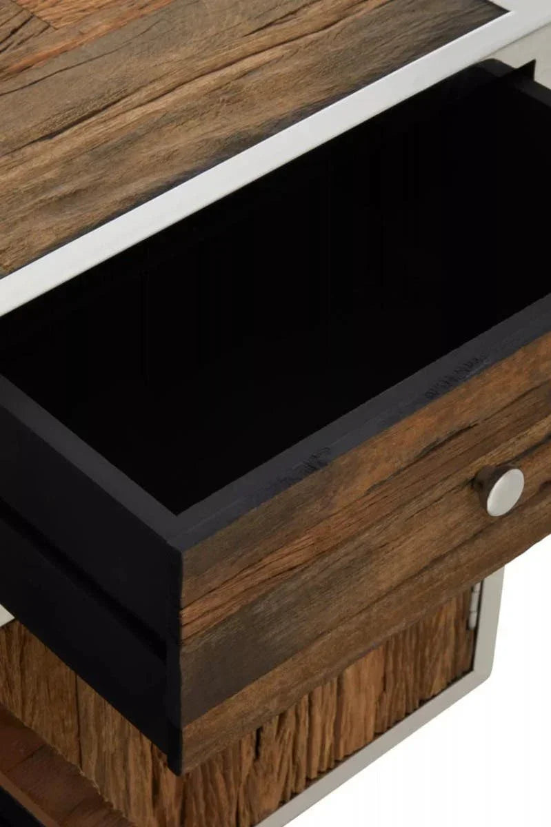 Close view of rustic wood bedside table drawer with metal handle and trim