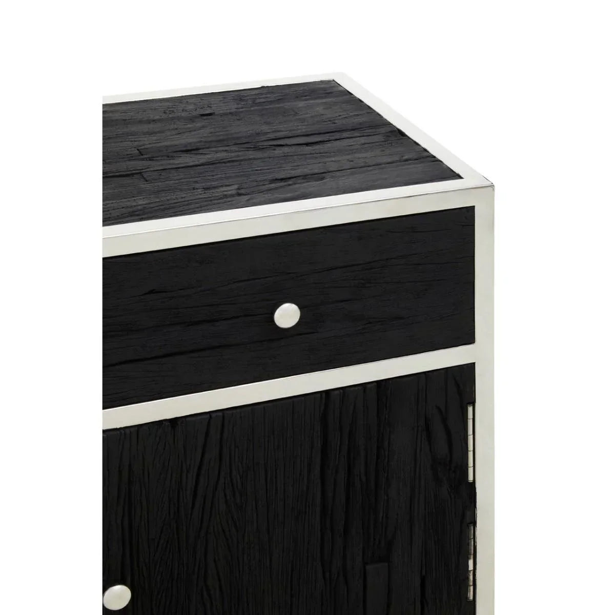 Black wood drawer unit with silver trim and metal knob, close-up of textured finish