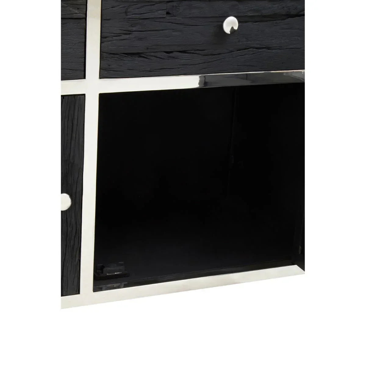 Closeup of black wood sideboard with open storage compartment and silver trim