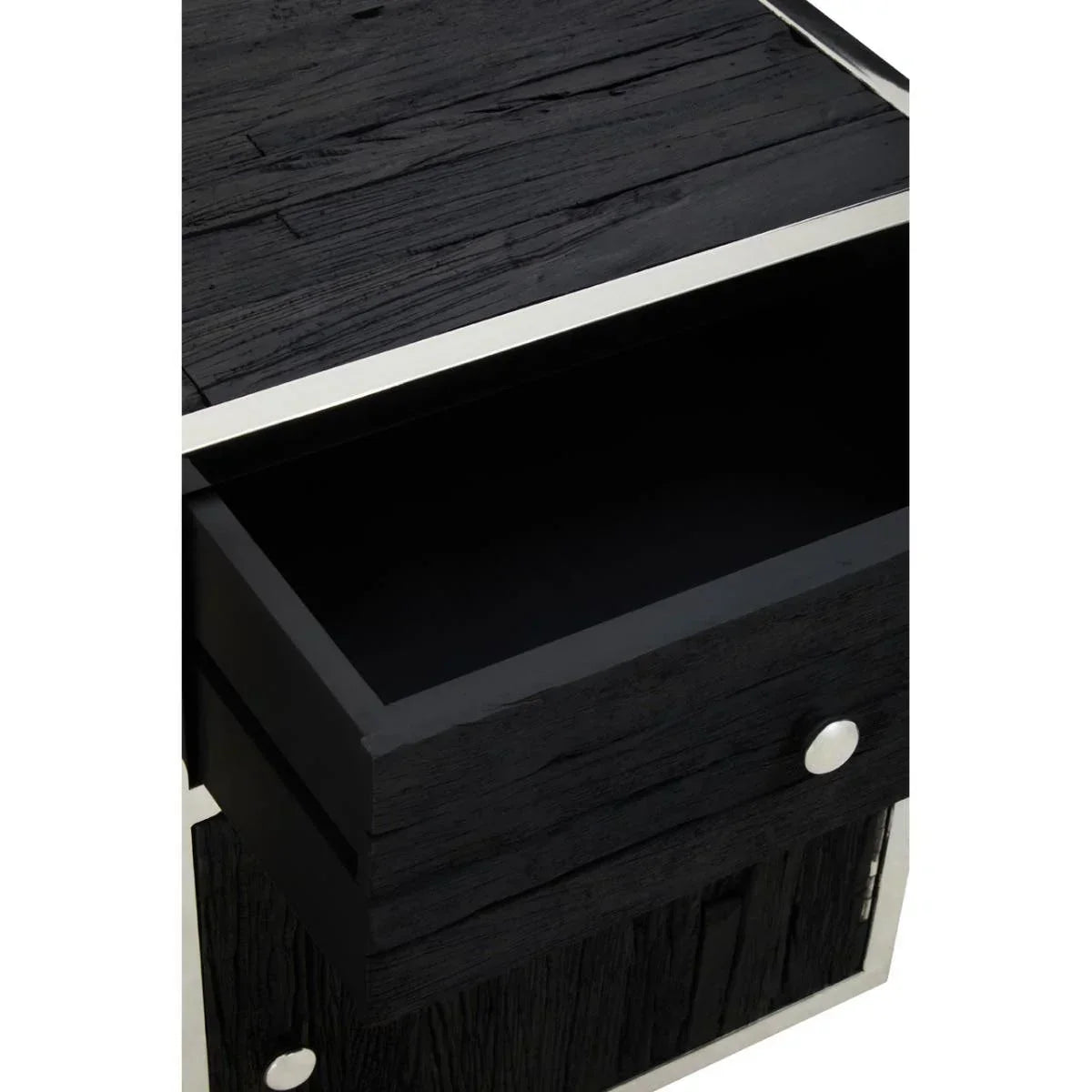 Black wood bedside table with open drawer and silver trim detail, close-up view