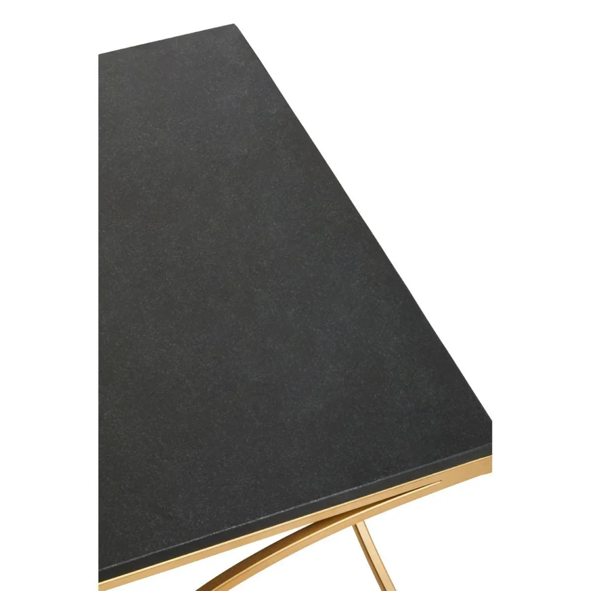 Black dining table with rectangular stone top and gold metal legs, close up angle