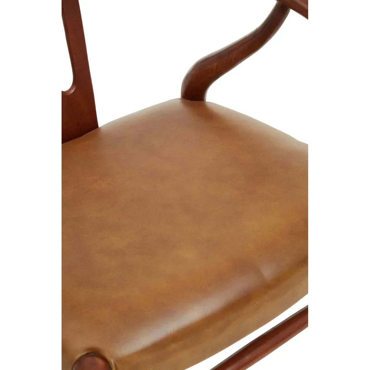 Close-up of brown leather dining chair seat with wooden frame and curved armrest