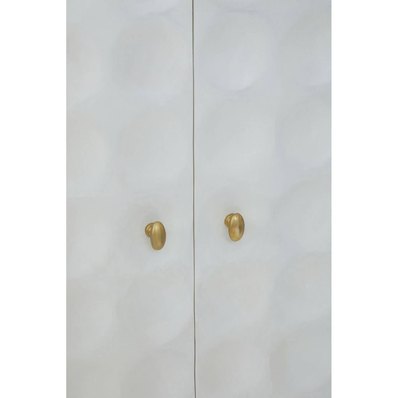 Cream finish two-door cabinet made from mango wood, featuring a textured geometric pattern on the doors and elegant gold handles
