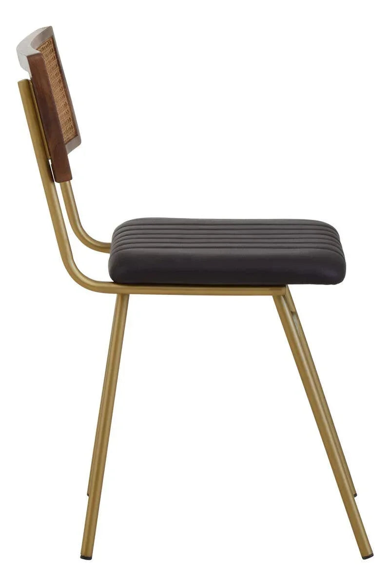 Side view of dining chair with gold legs, ribbed black seat and cane backrest