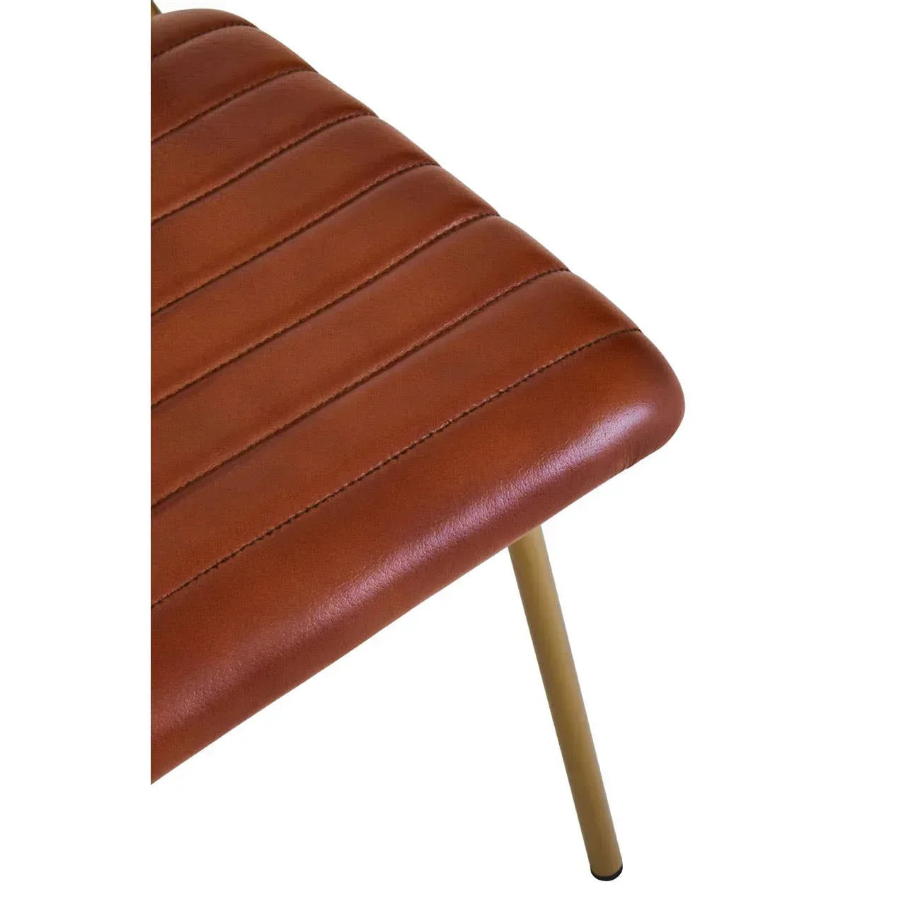 Brown faux leather dining chair seat with gold metal leg and stitched detail, close view