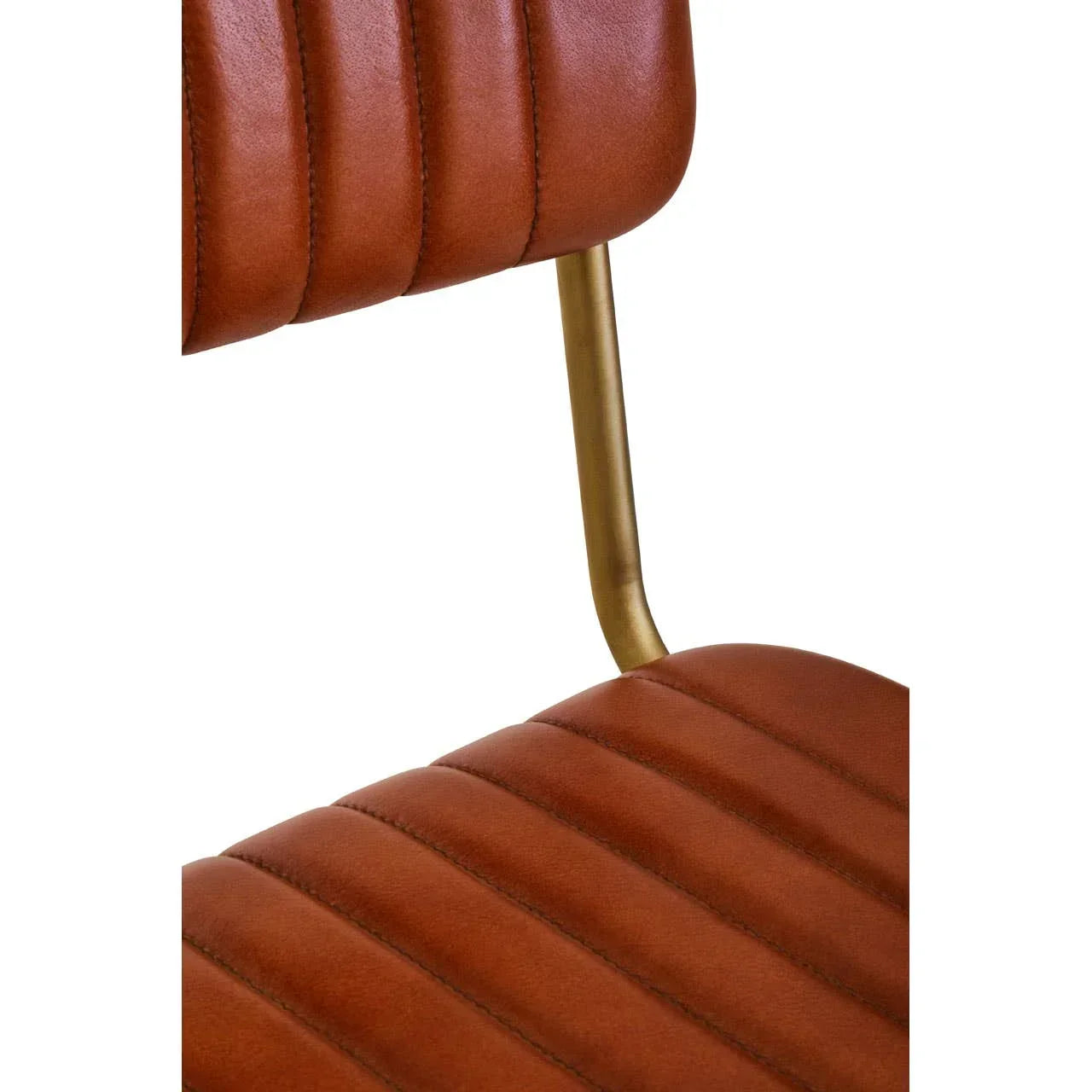 Close-up of brown faux leather dining chair with gold metal frame and stitched detail