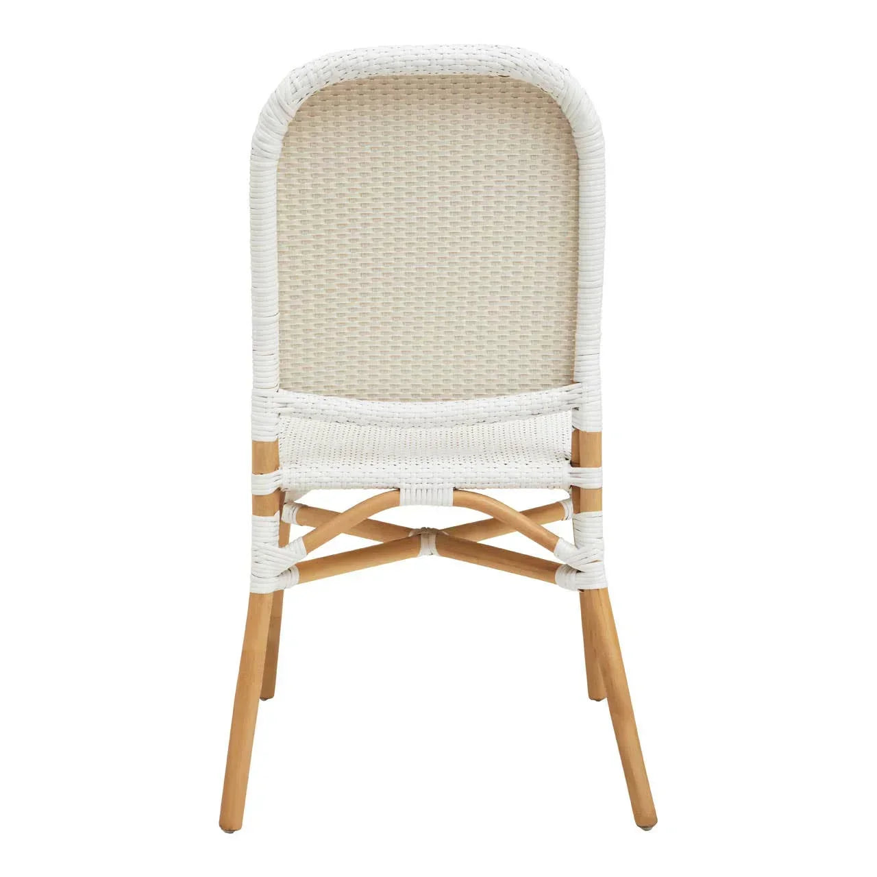 Rear view of white rattan dining chair with light wood legs and woven backrest