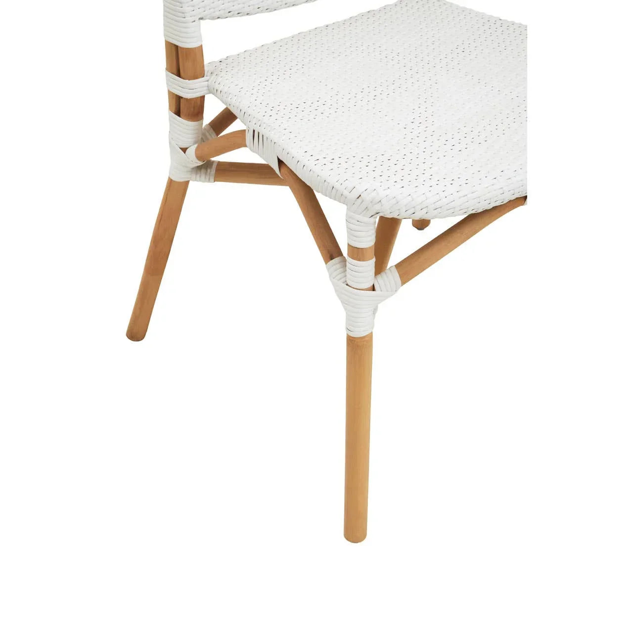 White rattan dining chair with wooden legs, close-up of seat and frame detail