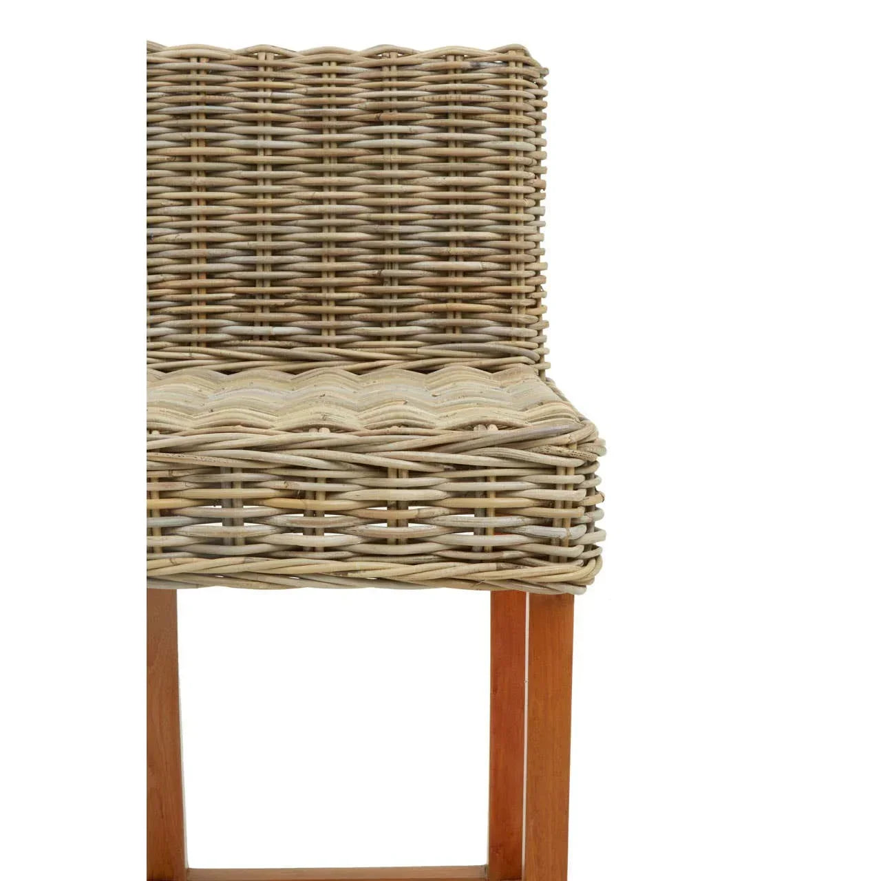 Close up of wicker dining chair with natural rattan seat and wooden legs