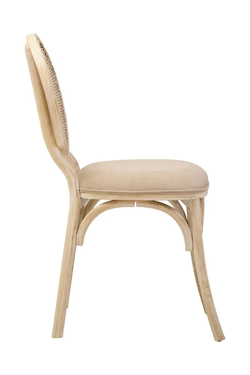 Side view of a beige upholstered dining chair with a light wood frame and curved legs