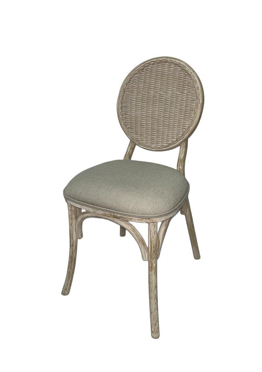 Rattan dining chair with round woven back and upholstered seat in natural wood finish