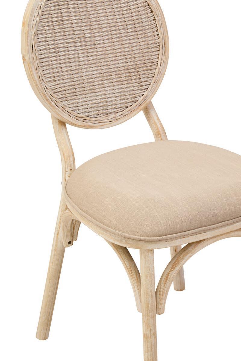 Beige rattan dining chair with round woven backrest and cushioned seat, wooden frame