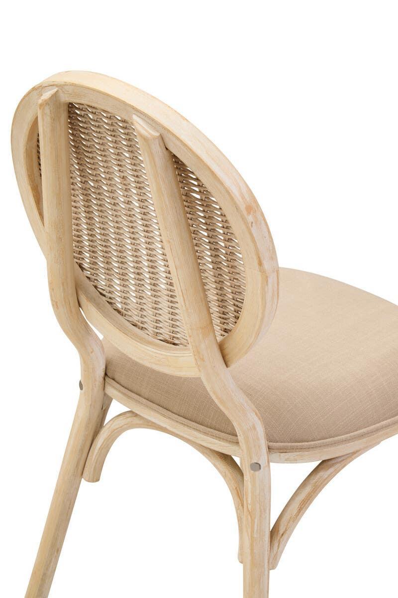 Natural rattan dining chair with curved wooden frame and beige cushioned seat, rear view