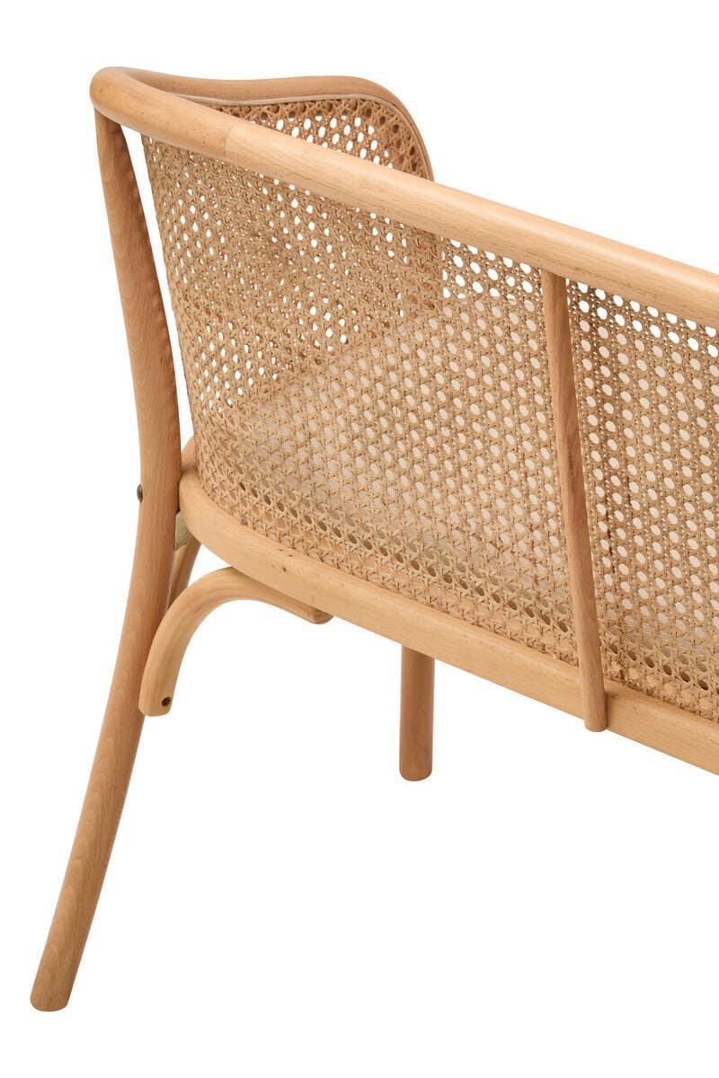 Natural wood sofa with woven cane backrest close-up