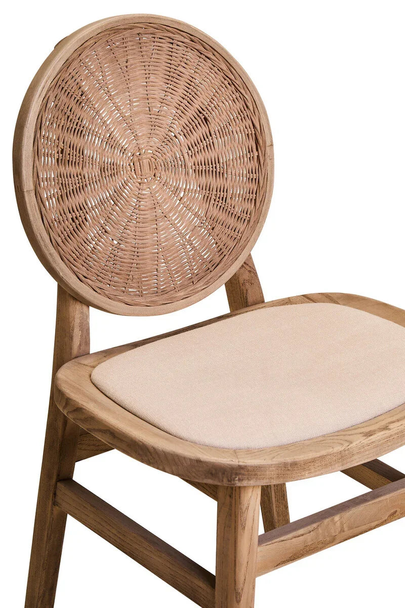 Wooden dining chair with round rattan backrest and beige cushioned seat