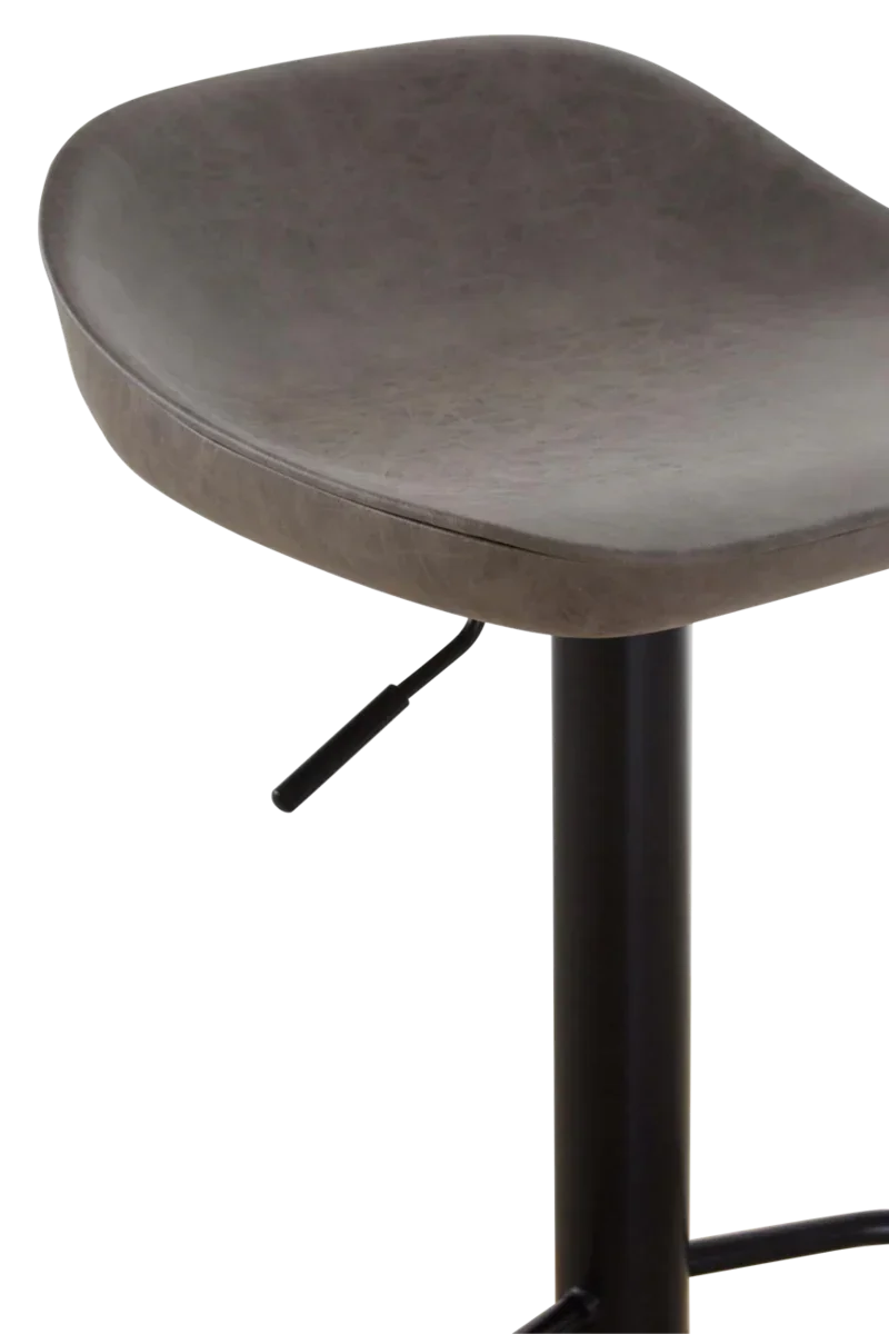 Close up of grey faux leather bar stool seat with black metal base and height lever